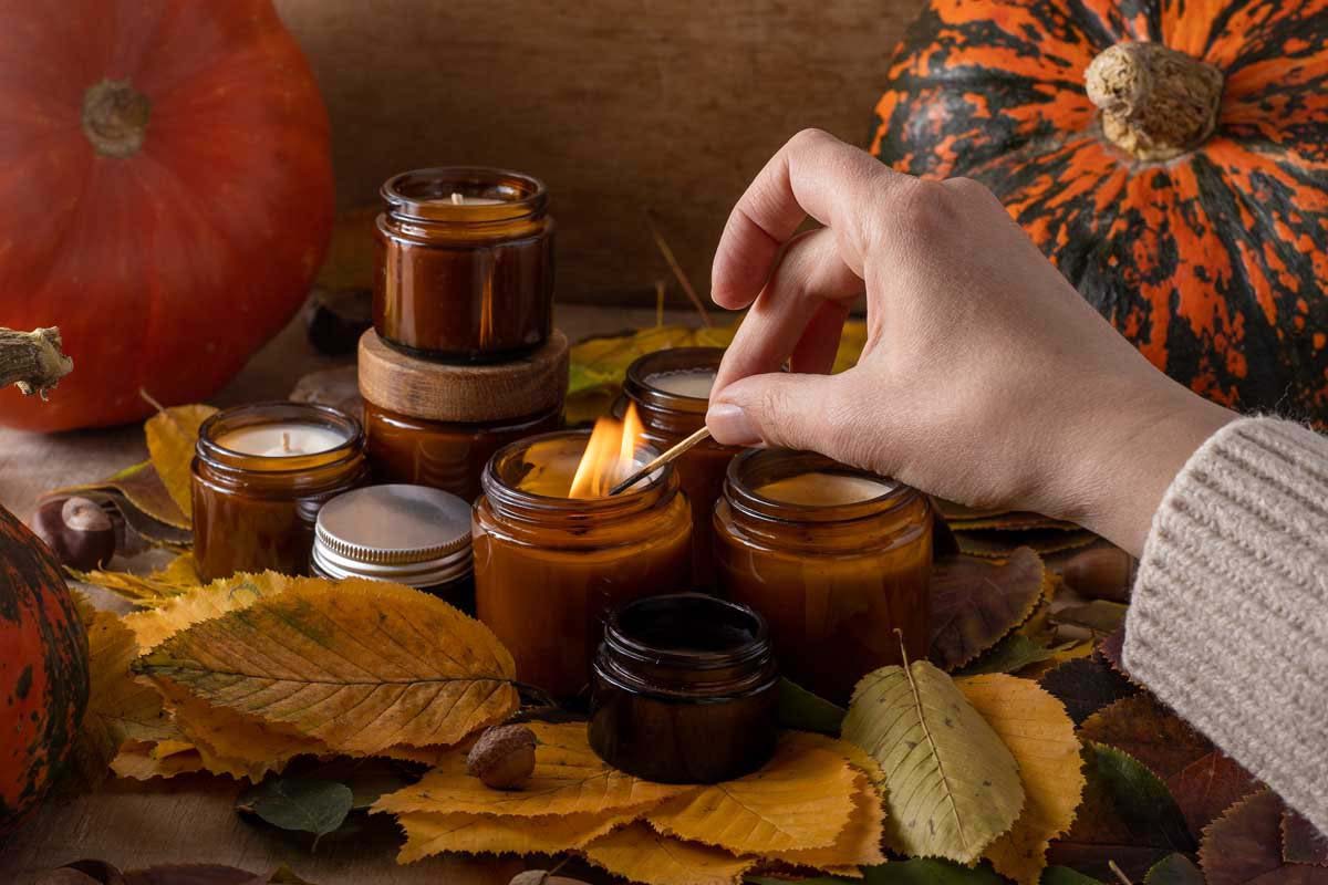soy candles burn in glass jars tree leaves pumpk